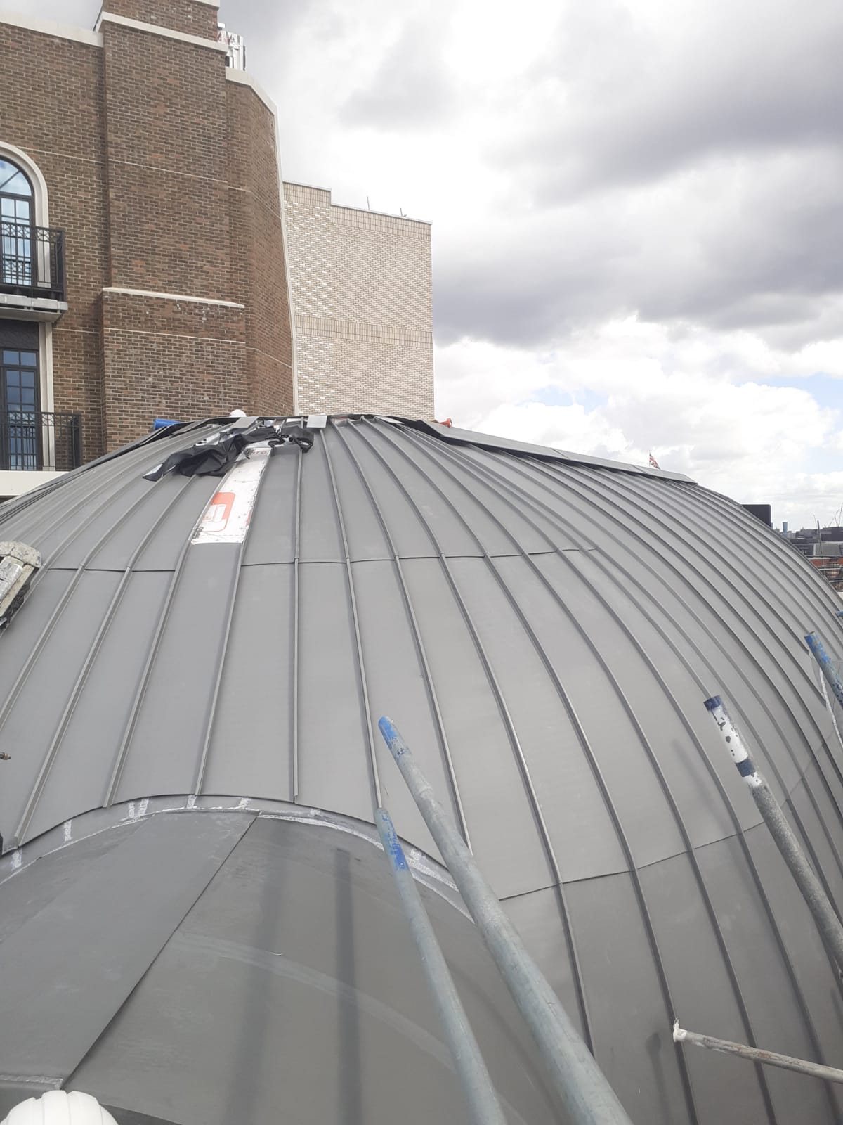 Natural zinc rotunda. Large natural zinc rotunda with hand tapered bays