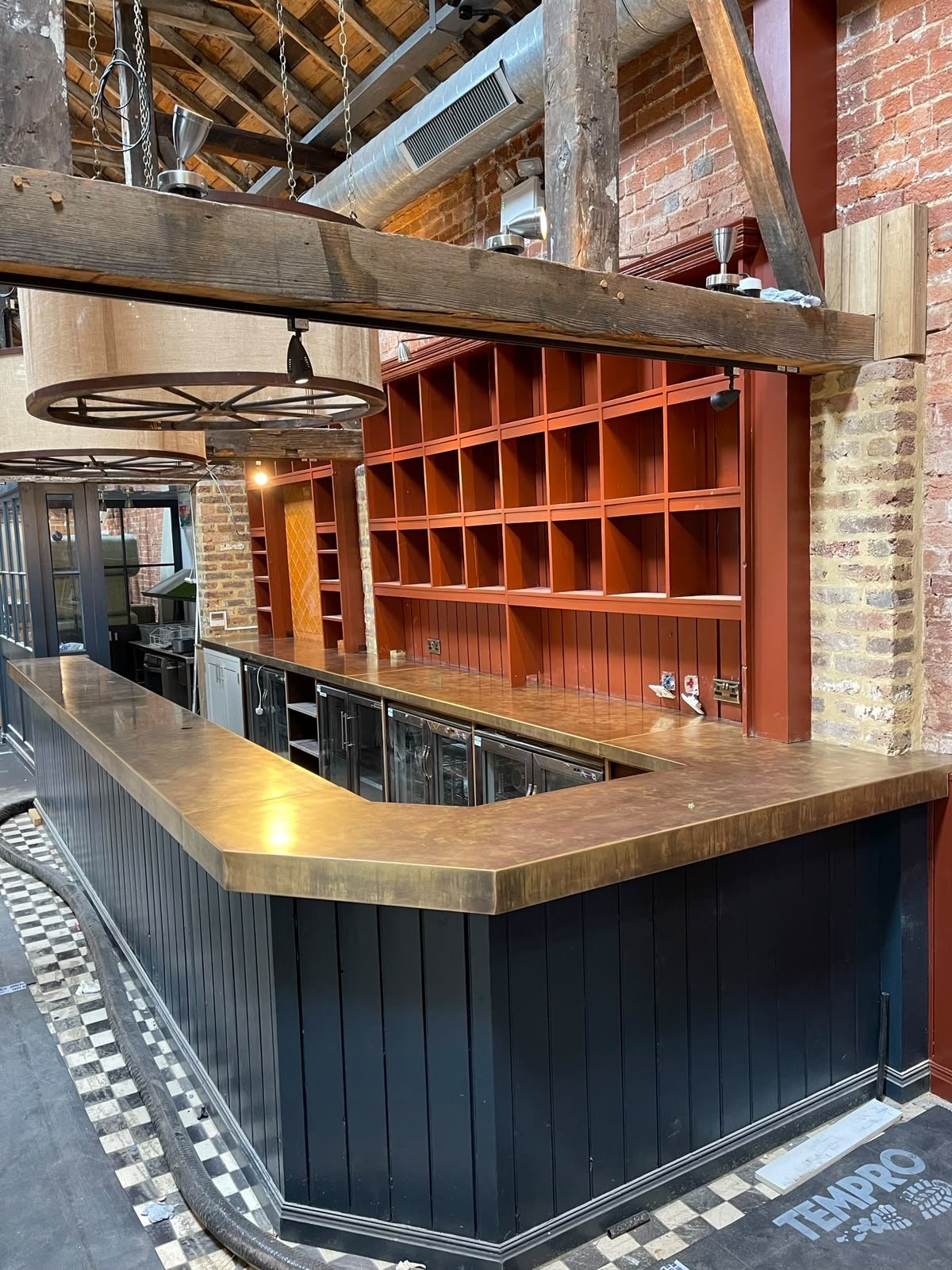 Brass bar top and back bar in a village pub