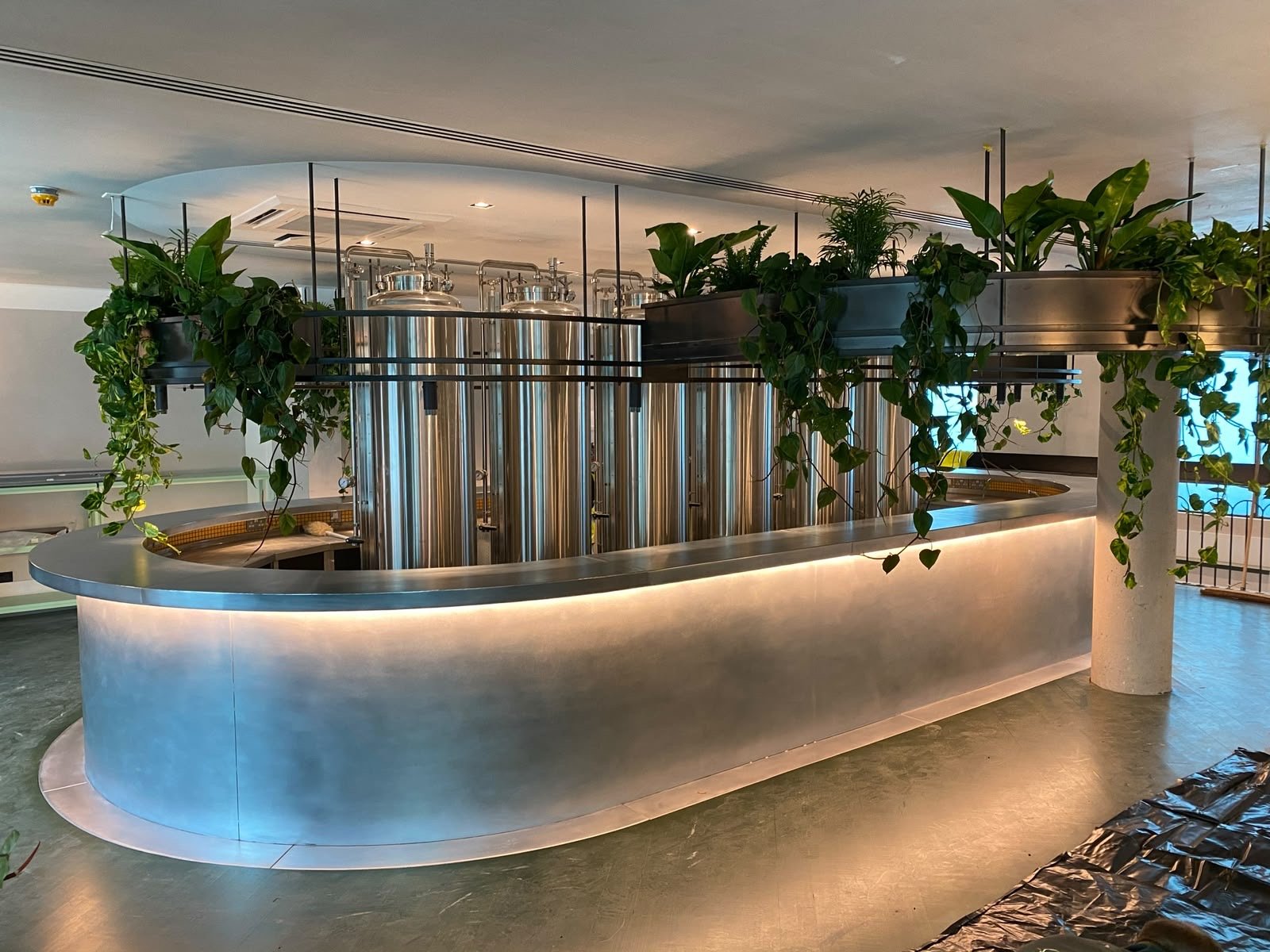 Curved zinc bar top in a working brewery